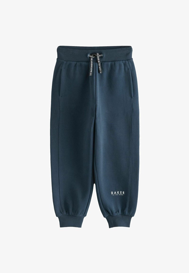 Jūras spēku sporta bikses, izgatavotas no mīksta materiāla, ar elastīgu jostasvietu ar auklu, sānu kabatām un ribotām aprocēm. Izstādīts zīmola logo.