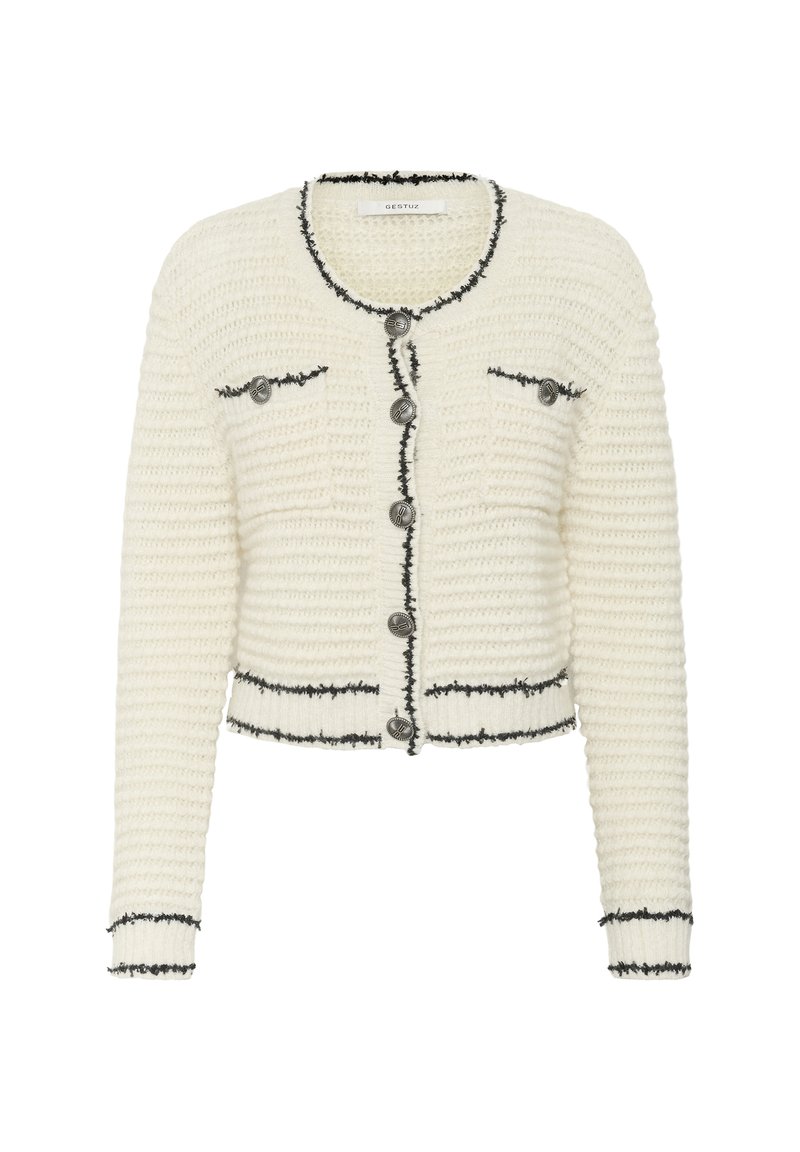 Weißer gestrickter Cardigan mit einem cropped Design, schwarzem Besatz und zwei Vordertaschen. Verfügt über große silberne Knöpfe entlang der Vorderseite.