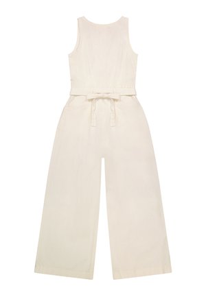 Bež predimenzioniran kombinezon brez rokavov z okroglo izrezom in širokimi hlačnicami, z modnim pasom, ki je zavezano zadaj na pasu.