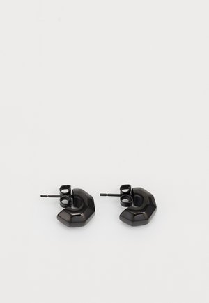 Black geometric stud earrings with a polished finish, featuring an angular design and securing post backs.