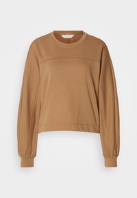 Sweat-shirt marron camel à manches longues avec col rond, poignets froncés et une couture horizontale à travers la poitrine.