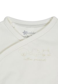 White baby onesie with cross-over neckline, featuring light beige sketches of a dog, sheep, and cat above "little friends" text.