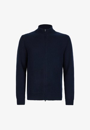 Marinblå ribbad zip-up tröja med hög krage, långa ärmar och strukturerat tyg, med hel dragkedja och åtsittande mudd.