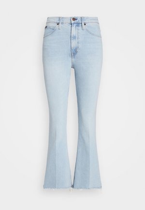 Lichtblauwe flare jeans van zacht denim, met een hoge taille, een onafgewerkte zoom en subtiele vervaging. Klassiek ontwerp met vijf zakken en koperen details.