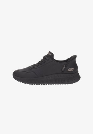 Black Skechers men's athletic sneaker with lace-up closure, textured sole, and subtle branding on side and tongue.