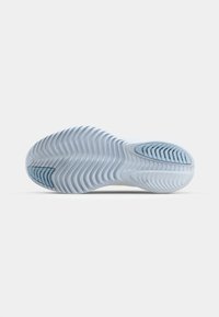 Såle av sko med et fleksibelt, bølgete design i lyseblått, med en mørkere blå gummiseksjon for grep.