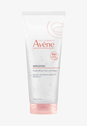 Transparent tube of Avène Micellar Gel with a pink cap. Label features orange text and water droplet graphics. Size and usage instructions visible.