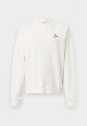 Sweatshirt blanc en coton doux, avec un col rond et des manches longues. Il possède un petit logo imprimé sur la zone supérieure gauche de la poitrine.