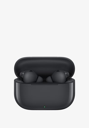 Wireless earbuds with a glossy black charging case, lid open, showcasing rounded earbuds inside and a small green status light.