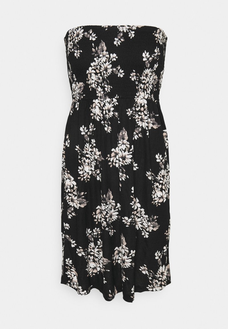 Rochie neagră fără bretele, cu un bust smockat, prezentând un model floral în alb și bej. Se împarte ușor la lungimea genunchiului, având o textură moale.