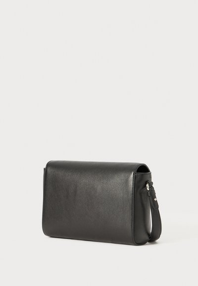 Black leather clutch bag with a rectangular shape, smooth texture, and a detachable strap, featuring minimalist design and no visible hardware.