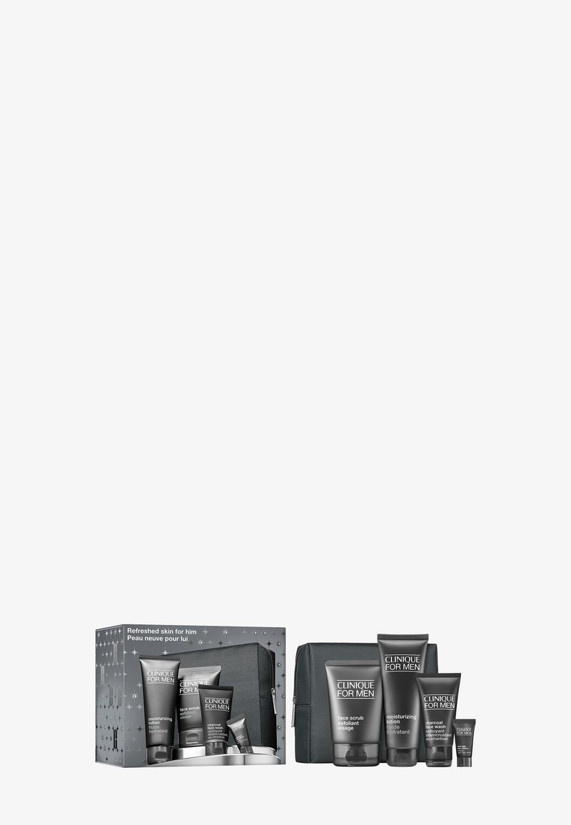 Herrvårdssats i svart förpackning, innehåller tuber och en väska. Har grå accenter och etiketter, med produkter för rengöring och återfuktning.