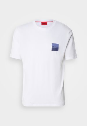 White cotton T-shirt with short sleeves, featuring a blue and purple square chest pocket displaying the "HUGO" logo in white. Red neck label.