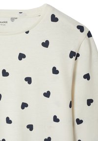 Kremfarbendes Langarmshirt aus Baumwolle mit verstreuten dunkelblauen Herzmustern. Verfügt über einen klassischen Rundhalsausschnitt und eine weiche Textur.