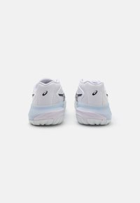 White athletic shoes with smooth synthetic material, rounded shape, and translucent blue accents on the soles. Features a logo on the side.