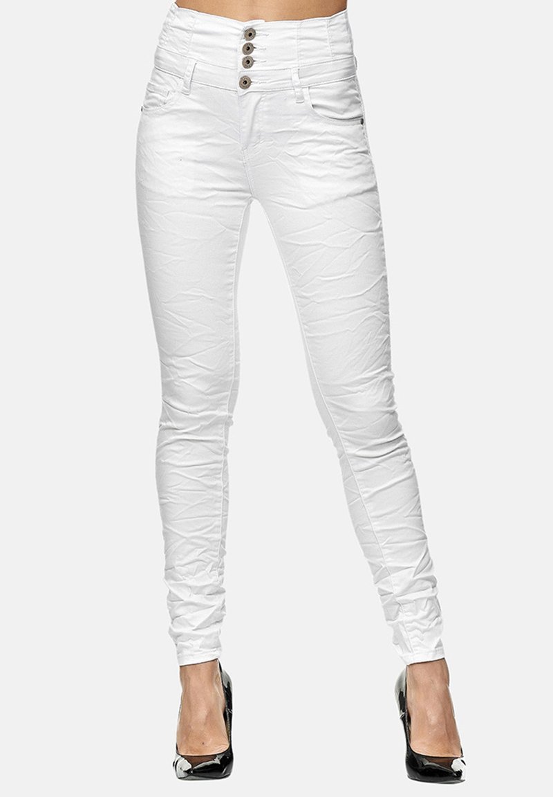 Pantalones vaqueros blancos ajustados de cintura alta, con un acabado texturizado, cierre de cinco botones y dos bolsillos delanteros.