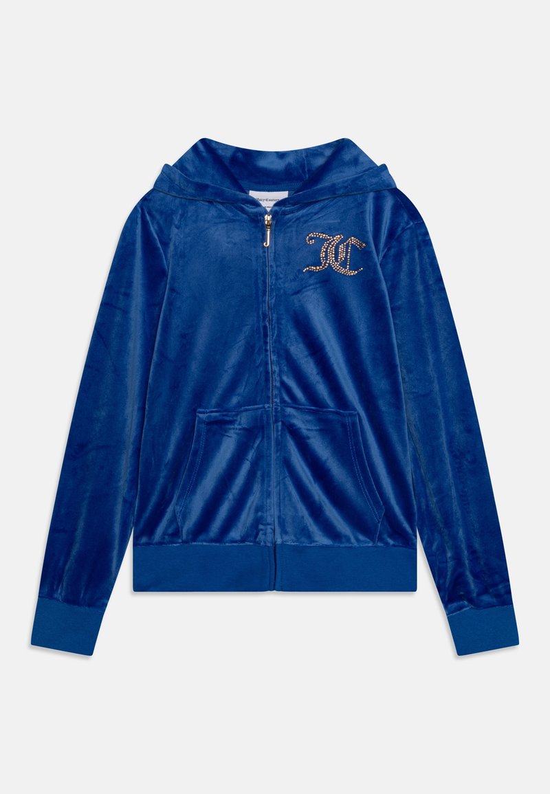 Blue velvet zip-up hoodie with a front logo in gold studs. Features a hood and two front pockets. Soft texture and fitted design.