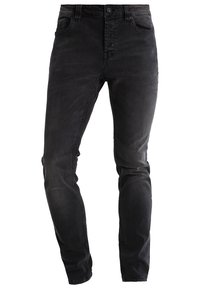 Svarta denimjeans med en figursydd design, fem fickor och kontrasterande sömmar. Mjuk textur med lätt slitage för ett vintageutseende.