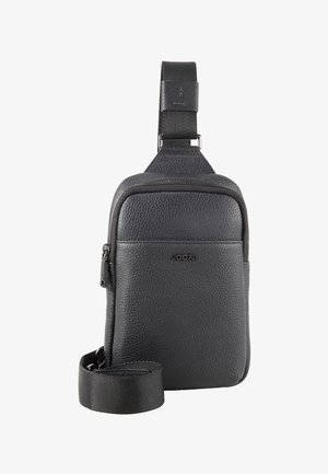 Sac bandoulière compact en cuir noir texturé avec poche zippée à l'avant, bandoulière réglable et logo "JOOP!" à l'avant.