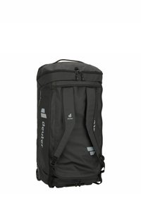 Sac à dos à roulettes noir avec bretelles ajustables, dessus zippé et logos. Fabriqué en tissu durable, il est équipé de roues lisses et d'une finition texturée.