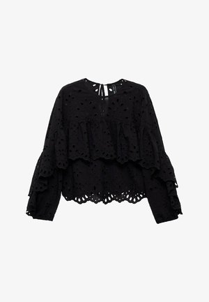 Black top with long sleeves, layered ruffles, and floral cut-out patterns. Features a tie closure at the back and a textured surface.