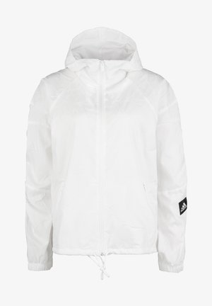 Valkoinen kevyt takki, jossa on tekstuuri kangas, vetoketjukiinnitys, säädettävä helma, huppu ja musta Adidas-logo vasemmassa hihassa.
