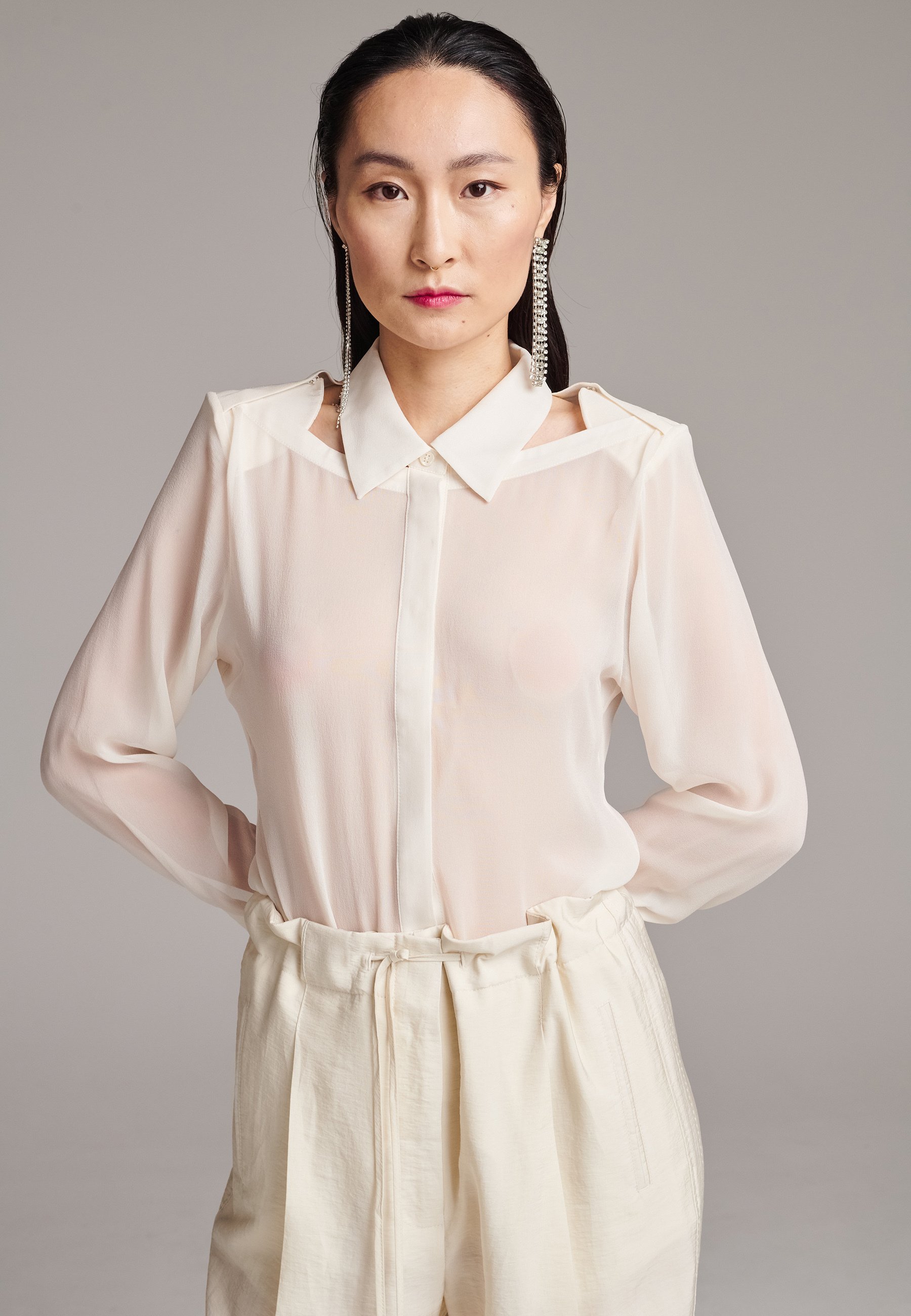 white cut out blouse