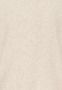 Ljust beige tyg med en mjuk, texturerad yta. Materialet verkar slätt med subtila nyansvariationer, utan tydliga mönster.