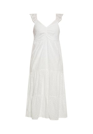 Robe blanche sans manches en tissu ajouré, bretelles à volants, col en V et jupe à étages.
