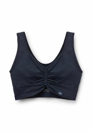 Navyblaues trägerloses Oberteil aus weichem Stoff, mit einem gerafften Design an der Vorderseite und breiten Trägern zur Unterstützung. Etikett sichtbar.