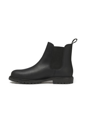 Botte Chelsea en cuir noir avec panneau latéral élastique, tirant à l'arrière et semelle en caoutchouc robuste pour une bonne traction.