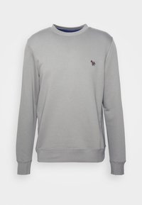 Sudadera gris hecha de una tela suave con cuello redondo. Presenta un pequeño logotipo multicolor en el pecho. Puños y dobladillo acanalados.