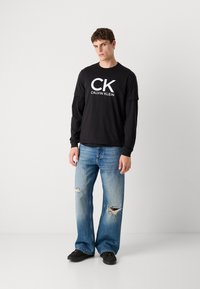 Calvin Klein Jeans GRAPHIC TEE - T-shirt print - black