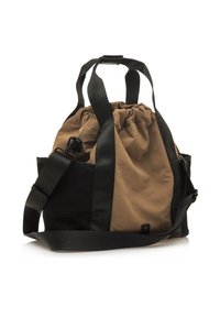 Beige Zugtasche mit schwarzen Trägern und Akzenten, aus weichem Stoff mit einem strukturierten Seitenbereich, der ein lässiges und gleichzeitig funktionales Design bietet.