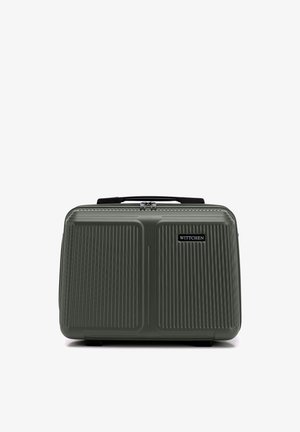 Hard-shell, donkergroene handbagagekoffer met getextureerde verticale lijnen, zwarte handgreep en 'Wittchen' merklabel aan de voorkant.
