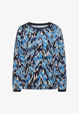 Chemise à manches longues à col rond avec un motif abstrait en zigzag bleu, noir, blanc, marron et rose, étiquetée "CECIL" à l'intérieur du col.