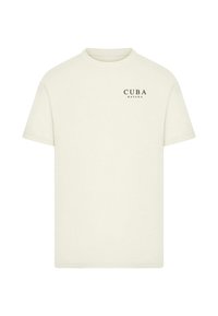 Krémové tričko z bavlny s krátkými rukávy, na levé části hrudi s nápisem "CUBA HAVANA" v černé barvě. Jednoduchý design.