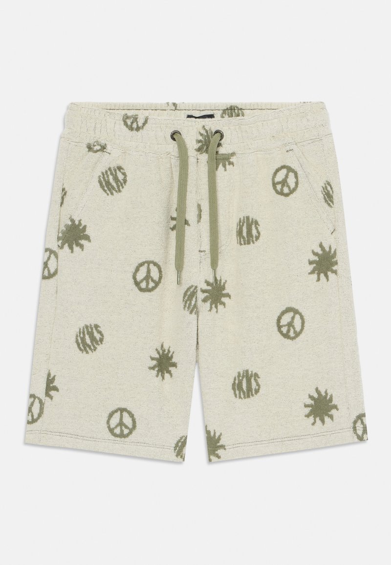 Shorts beiges clairs en tissu doux, arborant un symbole de paix vert et des motifs abstraits tout au long, avec une taille élastique et un cordon de serrage.