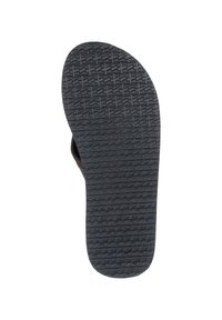 Semelle de tongs brune avec un dessous en caoutchouc noir texturé présentant des motifs en vagues. Design plat et large pour le placement du pied et la traction.