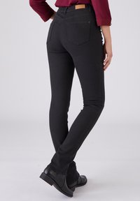 Damart TAILLE HAUTE PERFECT - Vaqueros slim fit - Black