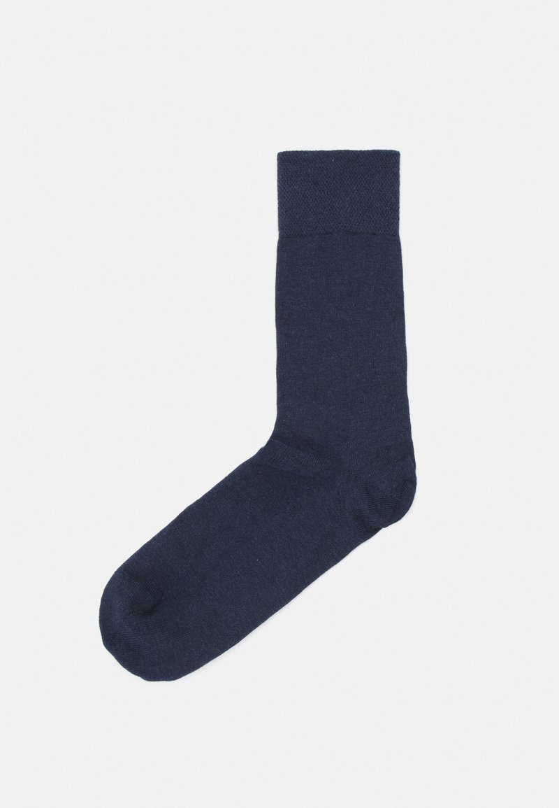 Mörkblå socka tillverkad av ett texturerat tyg. Har en ribbad kant högst upp och en slät tåsektion. Enkel, funktionell design.