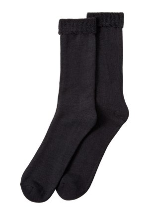 Paire de chaussettes noires unies avec revers pliés, présentées à plat sur fond blanc.