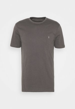 Szara bawełniana koszulka z okrągłym dekoltem, krótki rękaw oraz małym logo po lewej stronie klatki piersiowej. Posiada gładką, prostą fakturę.