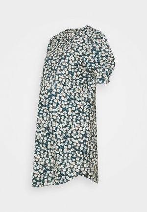 Robe florale avec un fond bleu sarcelle foncé, ornée de fleurs blanches et brunes, à manches courtes bouffantes et encolure arrondie. Design ample.