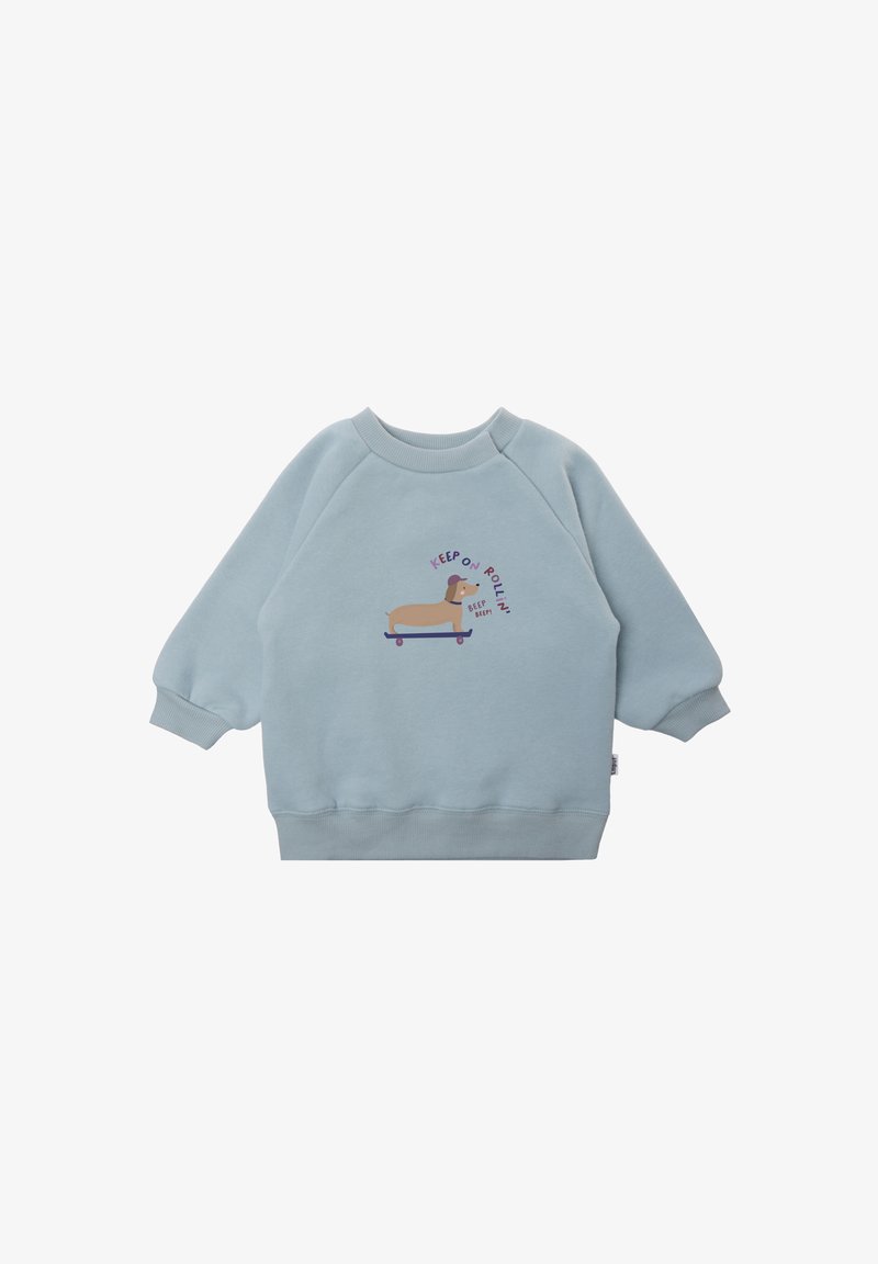 Helles blaues Sweatshirt mit Raglanärmeln, das einen cartoonhaften Hund auf einem Skateboard zeigt und den Text "KEEP ON ROLLIN'" trägt. Weicher Stoff, gerippte Bündchen.