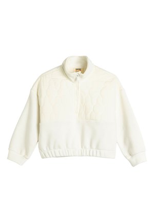 Pull blanc matelassé avec un col montant, une fermeture éclair et un ourlet côtelé. Il dispose de manches longues et d'un design texturé matelassé sur la section supérieure.