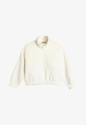 Pulóver blanco acolchado con cuello alto, cierre de cremallera y dobladillo acanalado. Presenta mangas largas y un diseño texturizado acolchado en la sección superior.