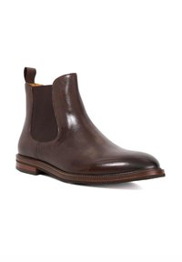 Brown leather Chelsea boot with elastic side panels, round toe, and contrasting dark brown and tan stacked heel. Smooth surface texture.