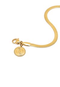 Gold snake chain bracelet with lobster clasp and small round charm featuring a stylized letter "S" in the center.
