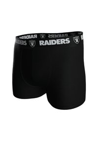 Boxers ajustados negros hechos de tejido elástico con una cinturilla gris que presenta el texto "RAIDERS" y un emblema. Textura suave, diseño ceñido.